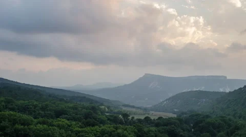 Misty Evening In Mountains With Moving Clouds And Sunshining Stock Footage 68786929