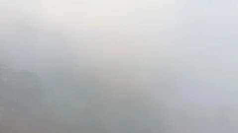 Misty forest, drone flying through the clouds at the top of mountain, aerial Vidéo 104107079