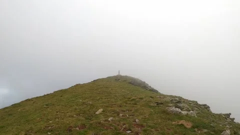 Misty heavy clouds at the top of the mountain. Video stock 142748948