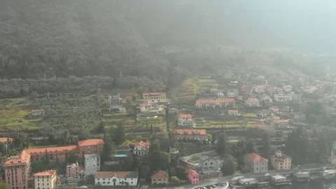 Misty hillside town with terracotta rooftops aerial view Stock Footage 341607388