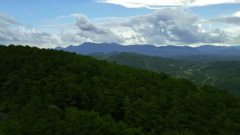 Misty Horizons: Aerial Spectacle of Cloud-Covered Mountains in 4K Delight Stock Footage 244475320