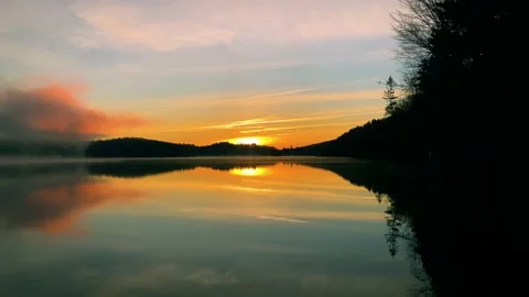 Misty lake at dawn Stock Footage 220146044