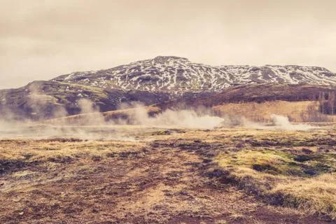 Misty landscape in front of a mountain Stock Photos