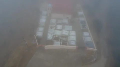 Misty mountain cemetery with marble graves in eerie silent landscape Stock Footage 344094937