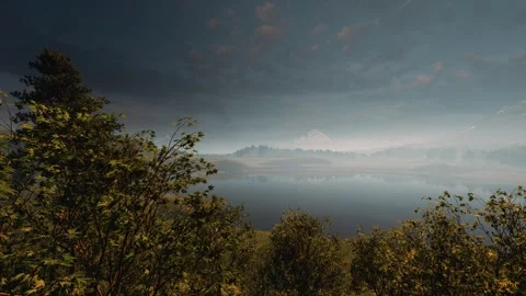 Misty mountain lake at dawn with dramatic dark clouds, cinematic view Stock Footage 338230661