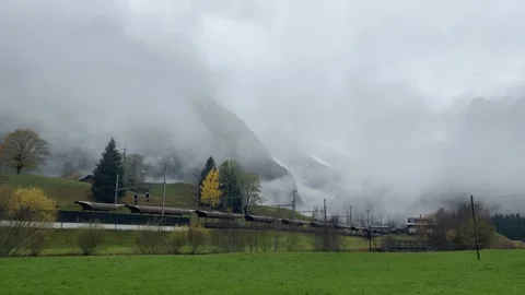 Misty Mountain Landscape Featuring Lush and Green Fields, Exuding Tranquil Vibes Stock Footage 305245487