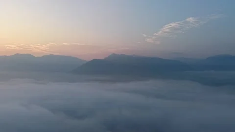 Misty mountain landscape with low clouds and soft early morning light Stock-Footage 339858156