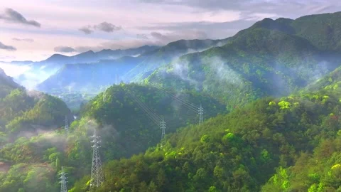 Misty Mountain Landscape with Power Lines and Verdant Foliage Stock Footage 301064589