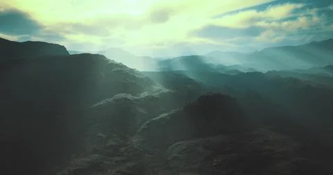 Misty mountain landscape with rays of sunlight breaking through clouds Stock Illustration