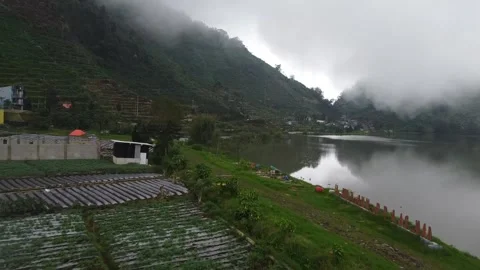 Misty Mountain Landscape with Terraced Fields and Lake Stock-Footage 280018155