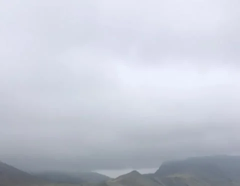 Misty mountain landscape under cloudy sky Stock Footage 328564685