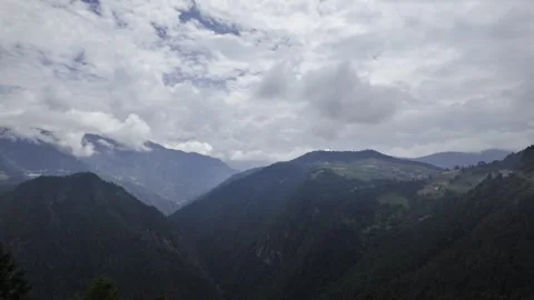 Misty Mountain Landscape with Wind Turbines and Cloudy Sky Stock Footage 340130724