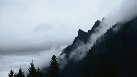 Misty Mountain Peak Emerging From Moving Clouds in Timelapse 库存影片 327170984