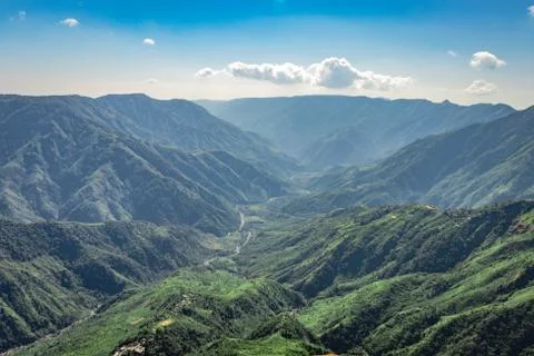 Misty mountain range covered with white mist and amazing blue sky 스톡 사진