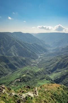 Misty mountain range covered with white mist and amazing blue sky Fotos de archivo