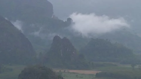 Misty Mountain Range with Fog Drifting Through Valley Dramatic Nature Landscape Stock Footage 325237202