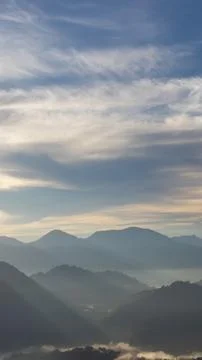 Misty Mountain Range at Sunrise Stock Photos