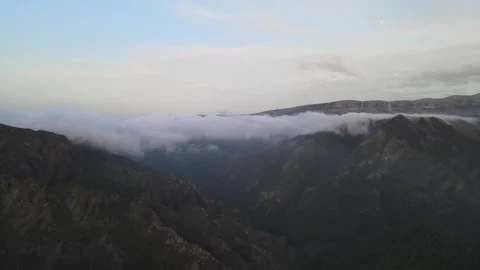 Misty Mountain Ridge Cloud Waterfall Fly Forward Twilight HQ Stock Footage 337023060