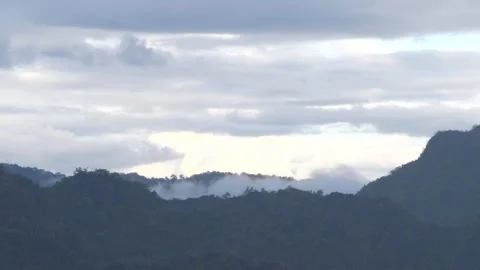 Misty Mountain Ridge with Low Clouds and Soft Morning Light Video stock 325237173