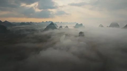 Misty Mountain River Landscape Under a Dramatic Cloudy Sky Stock-Footage 341738803