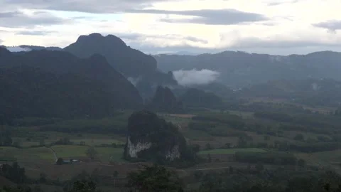 Misty Mountain Valley Landscape with Dramatic Clouds and Rural Farmland Video stock 325237223