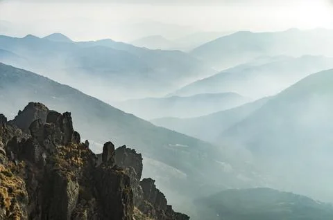 Misty mountain valley Stock Photos