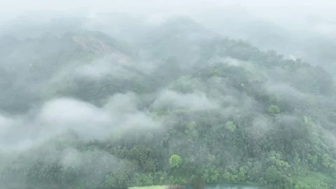 Misty Mountains After Rain Clouds Curling Through Remote Valleys Aerial Stock Footage 320449309