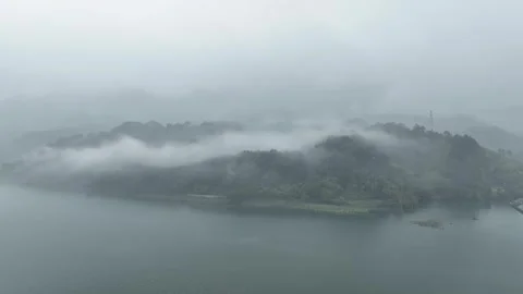Misty Mountains After Rain Clouds Curling Through Remote Valleys Aerial Stock Footage 320449384