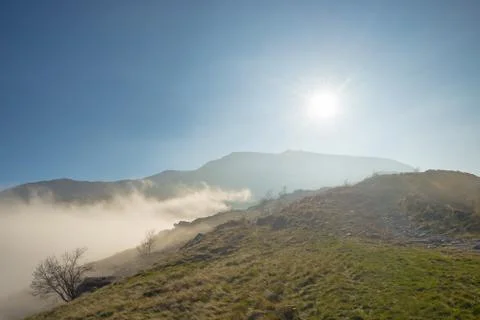 Misty mountains in backlight Stock Photos
