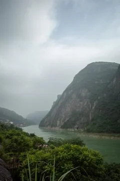 Misty mountains frame a winding river Stock Photos