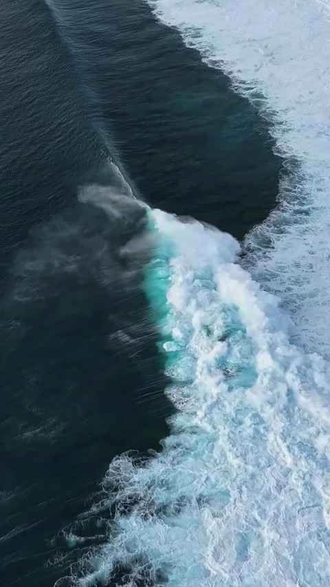 Misty Ocean Waves Rolling Over Dark Waters with Turquoise Highlights Stock Footage 334794605