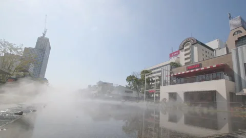 Misty pool of water in front of TGI Friday's restaurant in Nagoya, Japan. Stock Footage 217280070