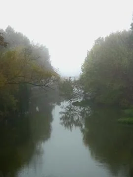 Misty river reflection scene Stock Photos