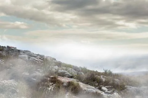 Misty rocky hillside is emerging under overcast clouds in flat design featuring Stock Illustration