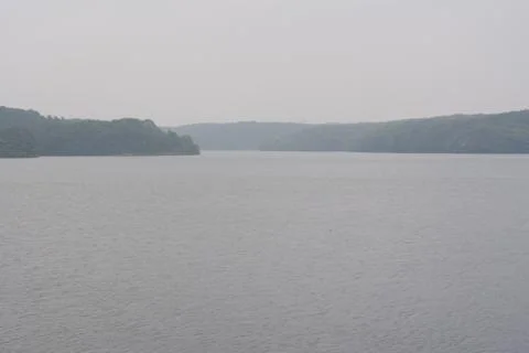 Misty somber lake Stock Photos