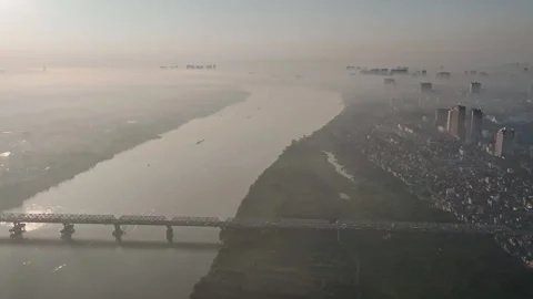 Misty Sunrise Over the Red River and Hanoi Cityscape Stock-Footage 344743404