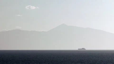 Misty Sunset Over Mountain and Ship at Sea 스톡 동영상 293583860