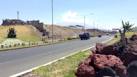 Misty volcano on the background of an auto road Arequipa, Peru timelapse Stock Footage 82464275