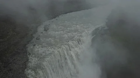 Misty waterfall flows in Iceland Stock Footage 166857461