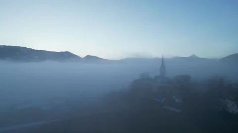 Misty Winter Mountain Valley in Carinthia with Church Tower Stock Footage 288041853