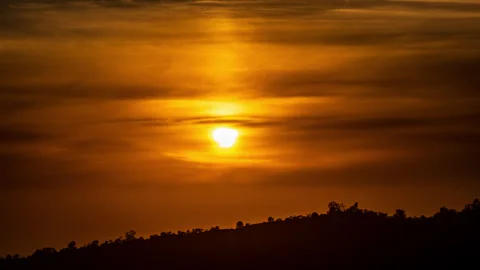 Misty Yellow Sun Sets through Gauzy Clouds Time Lapse Stock Footage 281489283