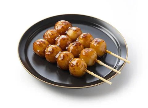 Mitarashi dango placed on a white background Stock Photos