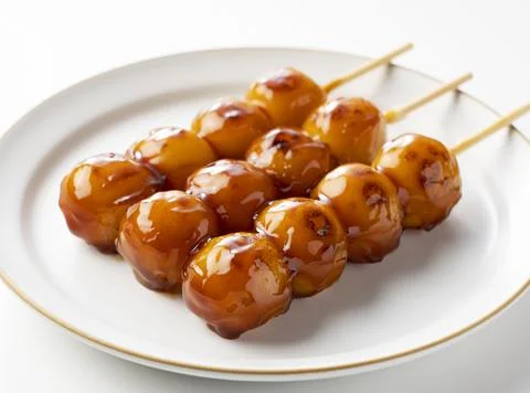 Mitarashi dango placed on a white background Stock Photos