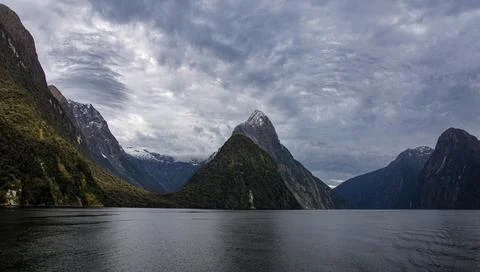 Miter Peak against dramatic sky Milford Sound New Zealand in 2023 Stock Photos
