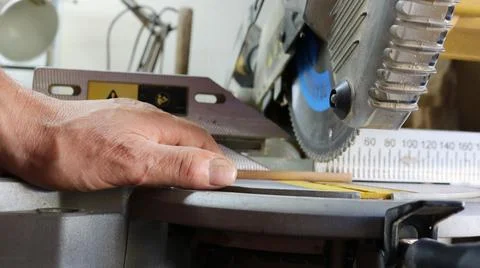 Miter saw blades while working with a small dowel Stock Photos