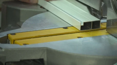 The miter saw cuts off the aluminum profile. Stock Footage