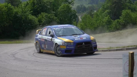 Mitsubishi Lancer Evo X R4 rally car takes a sharp turn Stock Footage 255964232