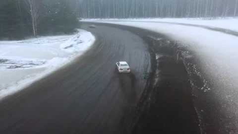 Mitsubishi Lancer Evolution 4 winter drift drone shot Stock Footage 167009680