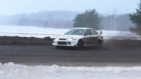 Mitsubishi Lancer Evolution 4 winter drift in snow and slow motion Stock Footage 167009688