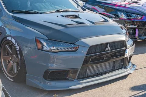 Mitsubishi Lancer Evolution, gray with dark accents, wide body kit, large rea Stockfoto's